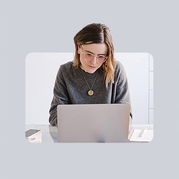 Professional working on laptop working on professional references